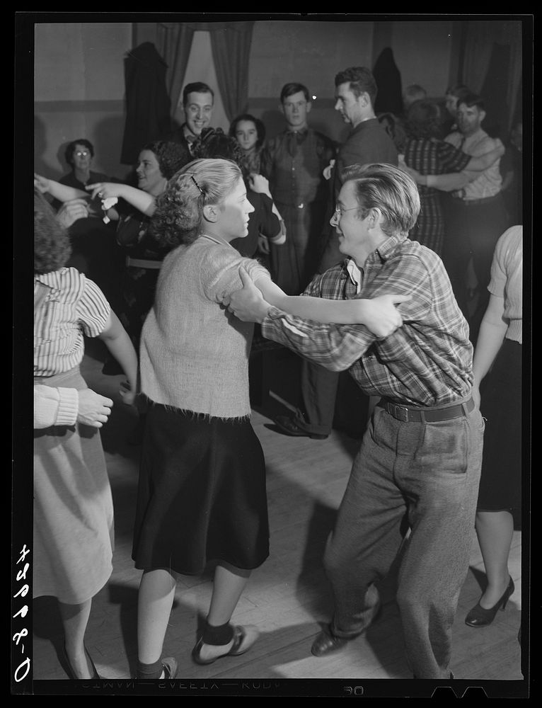 A Saturday night square dance run by Mr. and Mrs. Tucker in Clayville, Rhode Island. Mr. Tucker is the town police force.…
