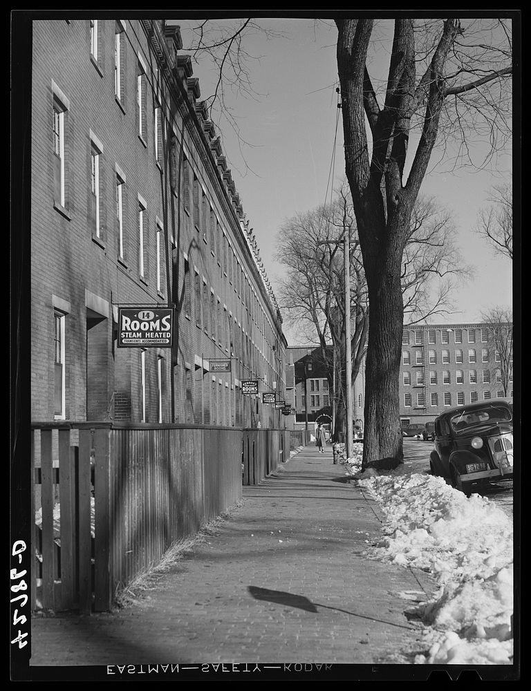 Rooming houses near a large mill in Lowell, Massachusetts. Sourced from the Library of Congress.