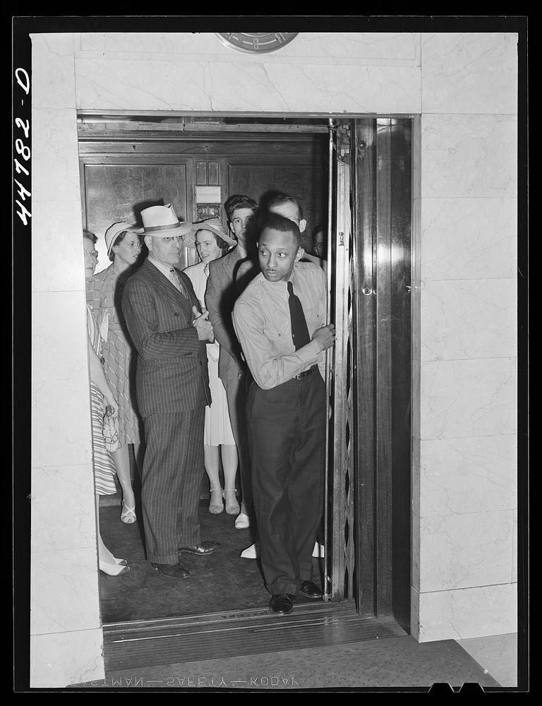 Elevator operator in the Barr Building. Washington, D.C.. Sourced from the Library of Congress.