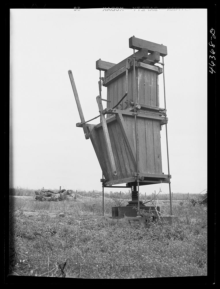 An old cotton pressing machine on a farm near Greensboro, Greene County, Georgia. Sourced from the Library of Congress.