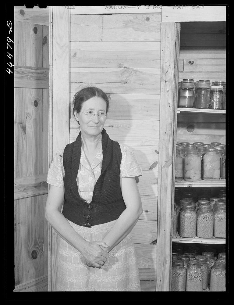 Mrs. Ira C. Brown with her canned goods. FSA (Farm Security Administration) clients. Her husband built the cupboard. Union…