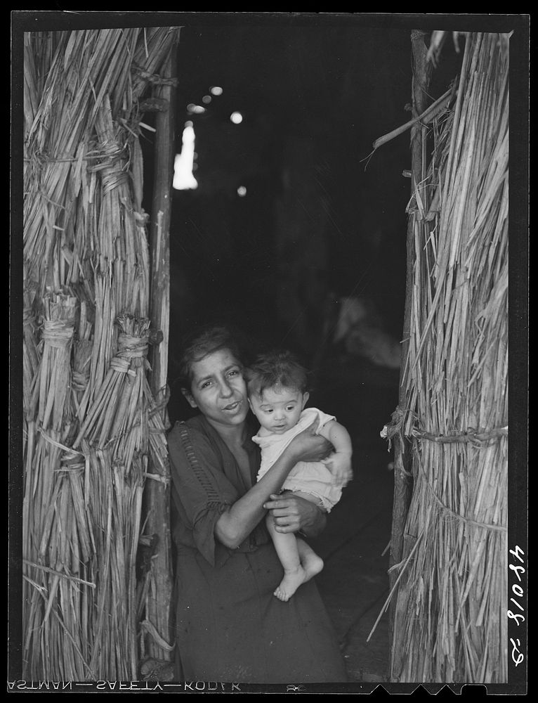 San Sebastian, Puerto Rico (vicinity). Widow and child of a farm laborer. Sourced from the Library of Congress.