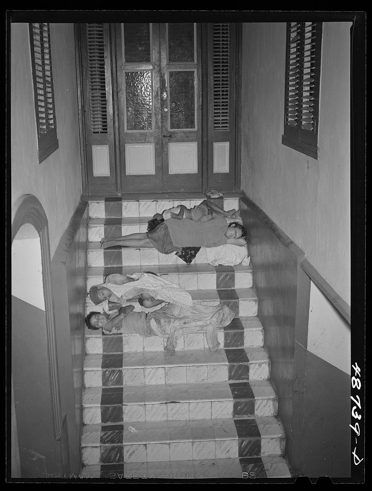 Caguas, Puerto Rico. Homeless people sleeping in the hallway of an apartment house. Sourced from the Library of Congress.