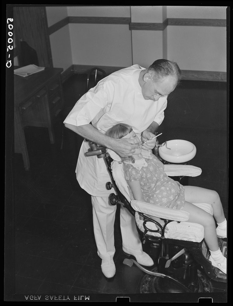Preschool examination and check up in dental clinic at Greenbelt, Maryland. Sourced from the Library of Congress.