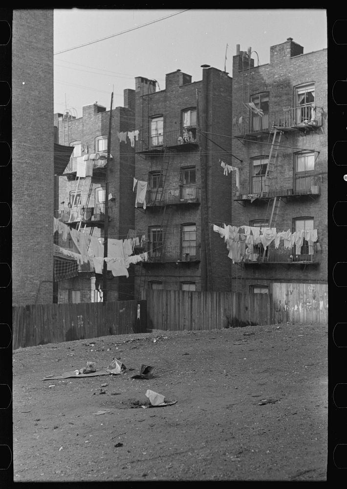 Apartment houses as viewed through vacant lot. In vicinity of 139th Street, just east of St. Anne's Avenue, Bronx, New York…
