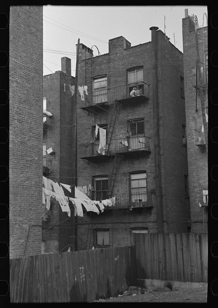 Apartment houses as viewed through vacant lot. In the vicinity of 139th street just east of St. Anne's Avenue, Bronx, New…