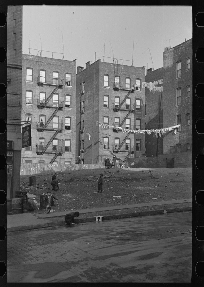 Apartment houses as viewed through vacant lot. In vicinity of 139th Street just east of St. Anne's Avenue Bronx, New York by…