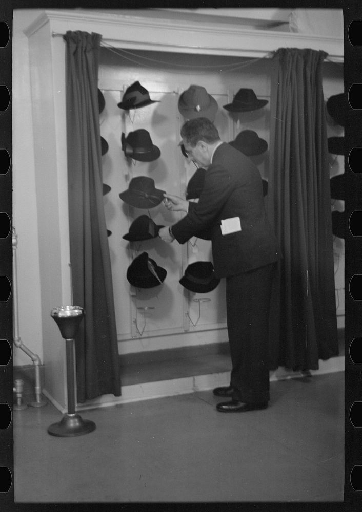 [Untitled photo, possibly related to: Model trying on hat for a buyer, New York City showroom, Jersey Homesteads…