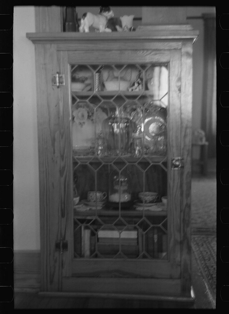 [Untitled photo, possibly related to: Corner of living room of Rustan brothers' farmhouse near Dickens, Iowa] by Russell Lee