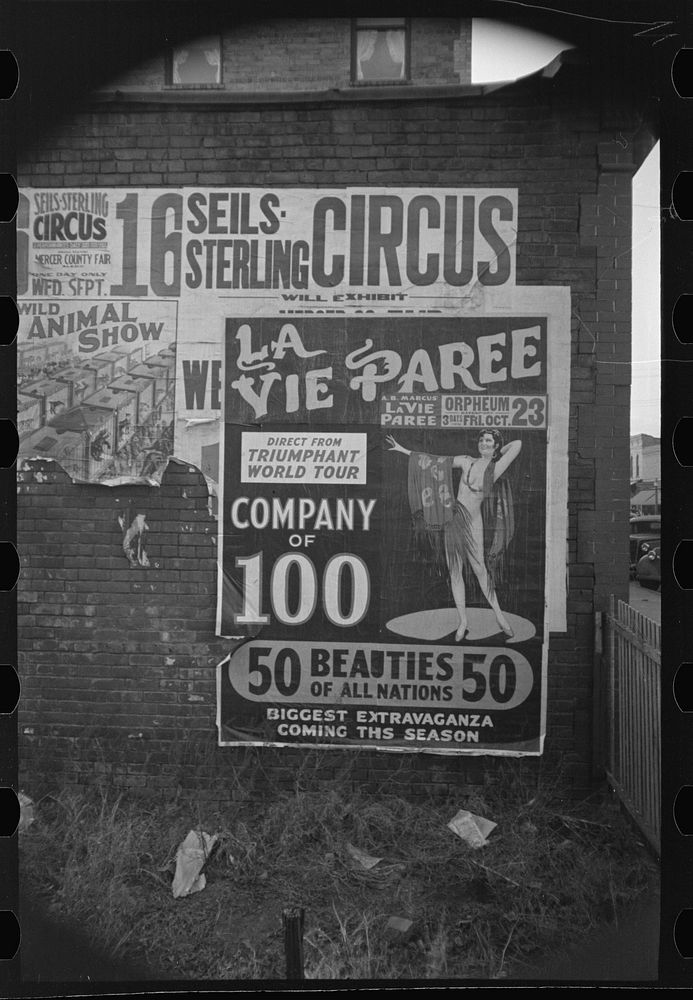 [Untitled photo, possibly related to: Sign pasted on building, Aledo, Illinois] by Russell Lee