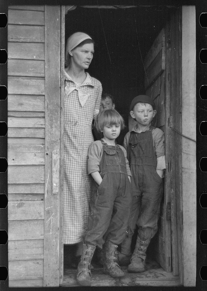 [Untitled photo, possibly related to: Mrs. Frank Moody with two of her seven children on their eighty acre farm in Miller…