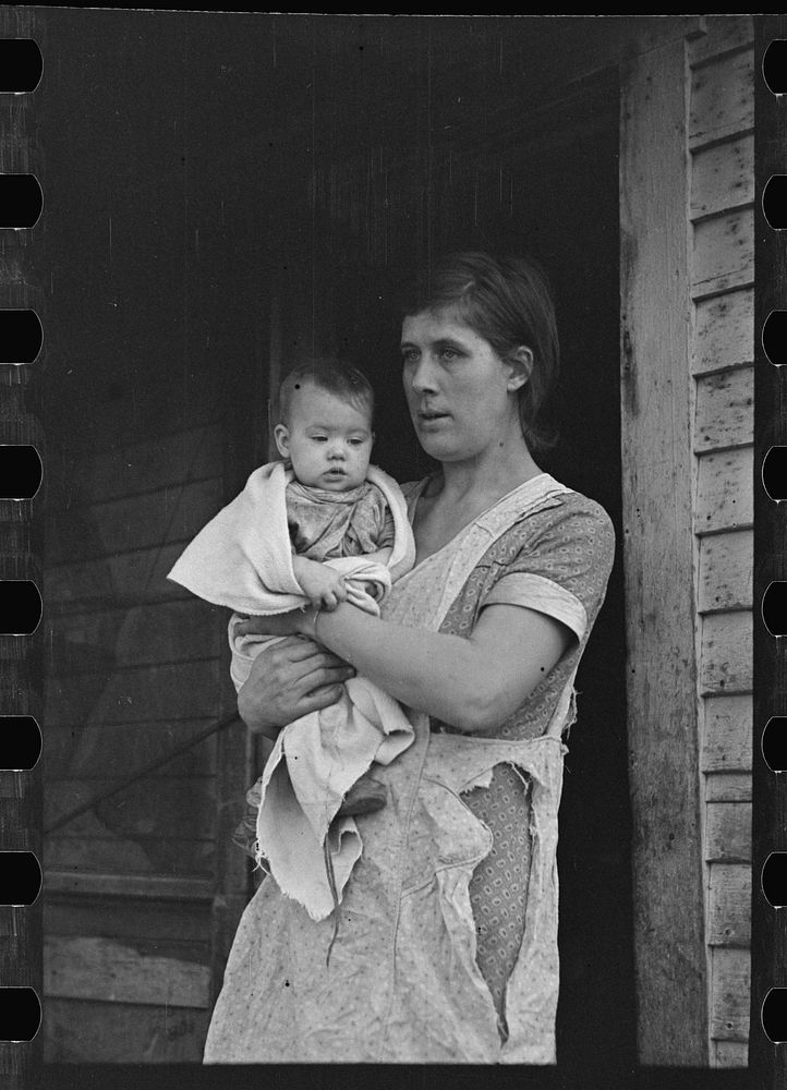 Mrs. Atkinson and baby. Atkinson rents from an estate and has eighty acres of very poor land on which to support his family…