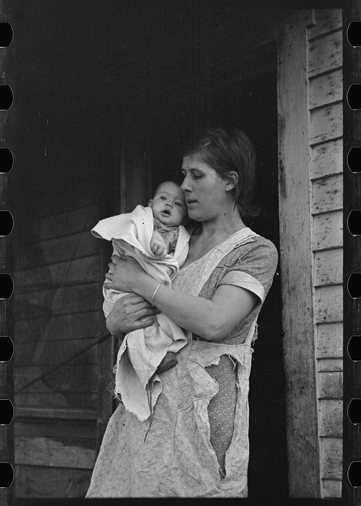 [Untitled photo, possibly related to: Mrs. Atkinson and baby. Atkinson rents from an estate and has eighty acres of very…