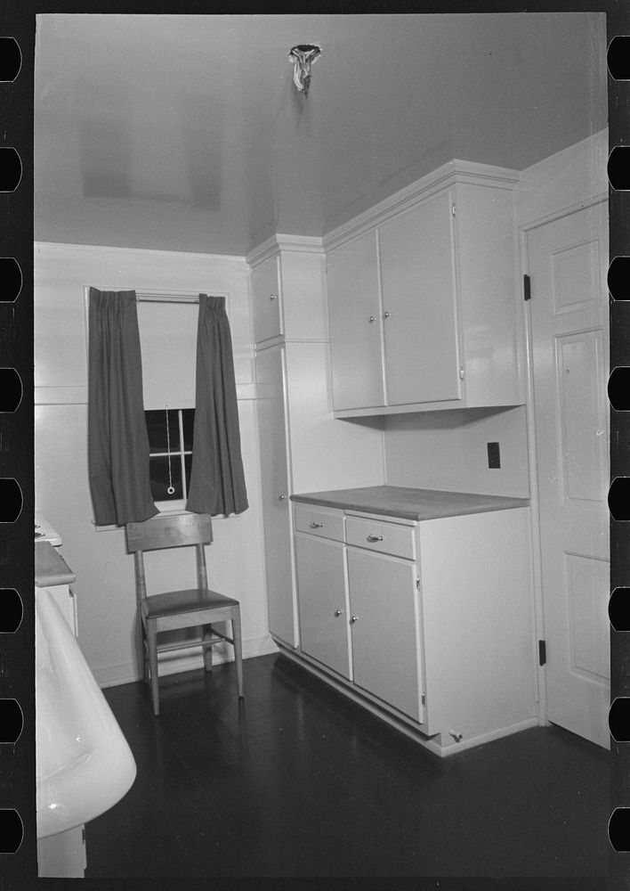 [Untitled photo, possibly related to: Sink, refrigerator and stove in the kitchen of the model house at Greendale…