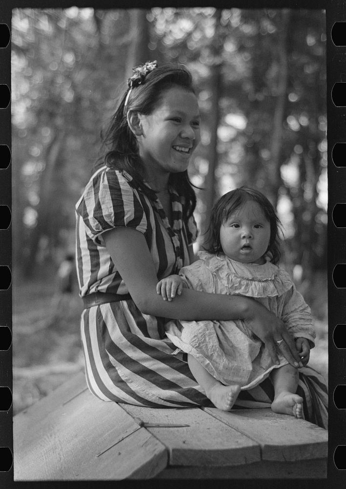 Young Indian mother and baby, blueberry camp, near Little Fork, Minnesota by Russell Lee