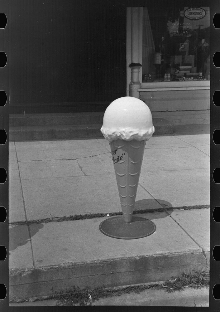 Model of ice cream cone in front of candy store, Sun Prairie, Wisconsin by Russell Lee
