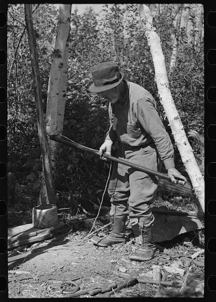 [Untitled photo, possibly related to: William Besson removing the iron pipe drill from casing near Winton, Minnesota] by…