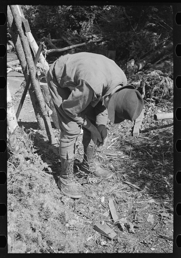 [Untitled photo, possibly related to: William Besson working on his drilling rig on location, near Winton, Minnesota] by…