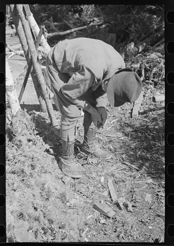 [Untitled photo, possibly related to: William Besson with a dip needle, near Winton, Minnesota] by Russell Lee