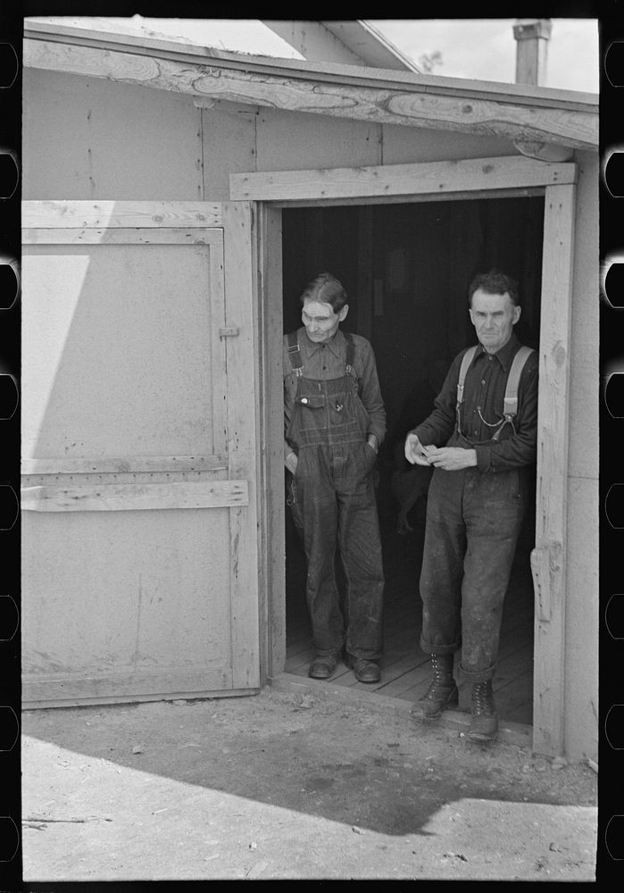 [Untitled photo, possibly related to: Lumberjacks in doorway of bunkhouse, near Effie, Minnesota] by Russell Lee