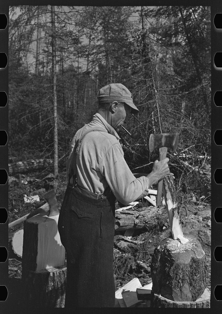 [Untitled photo, possibly related to: Using the broadaxe to make wedges, at camp near Effie, Minnesota] by Russell Lee
