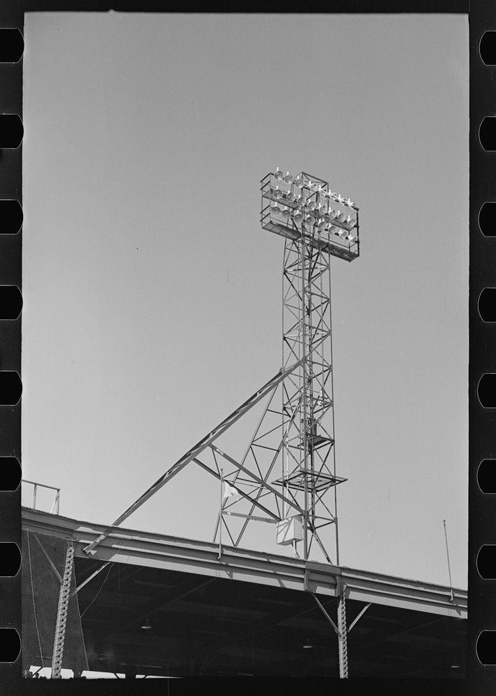 [Untitled photo, possibly related to: Signs and lighting standards at baseball park, Saint Paul, Minnesota] by Russell Lee