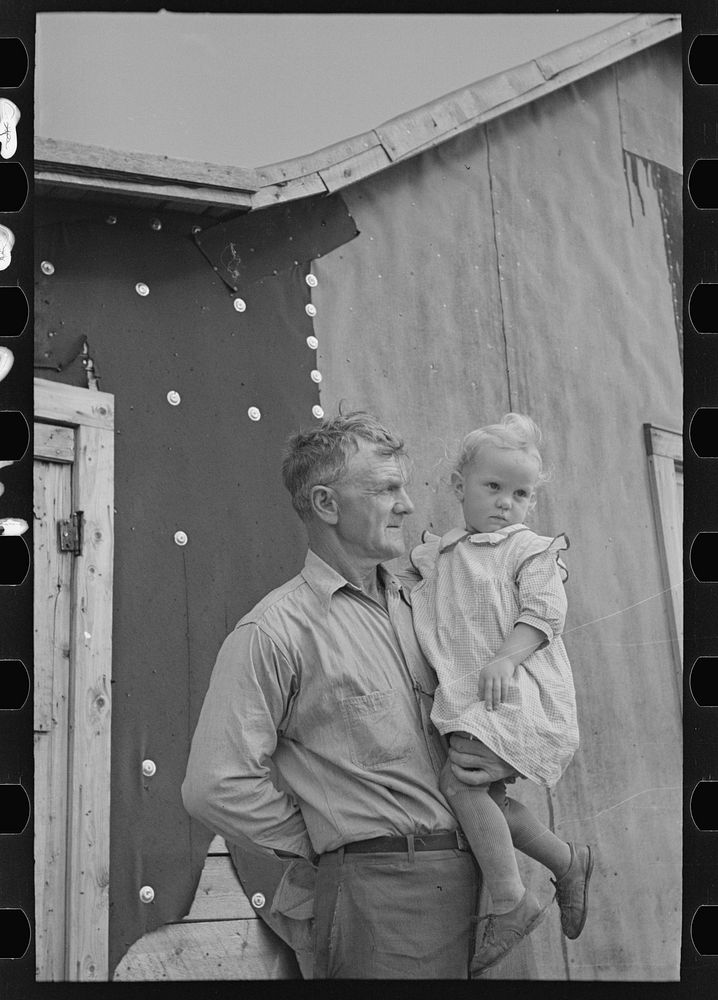 [Untitled photo, possibly related to: Cut-over farmer and daughter, near Northome, Minnesota] by Russell Lee