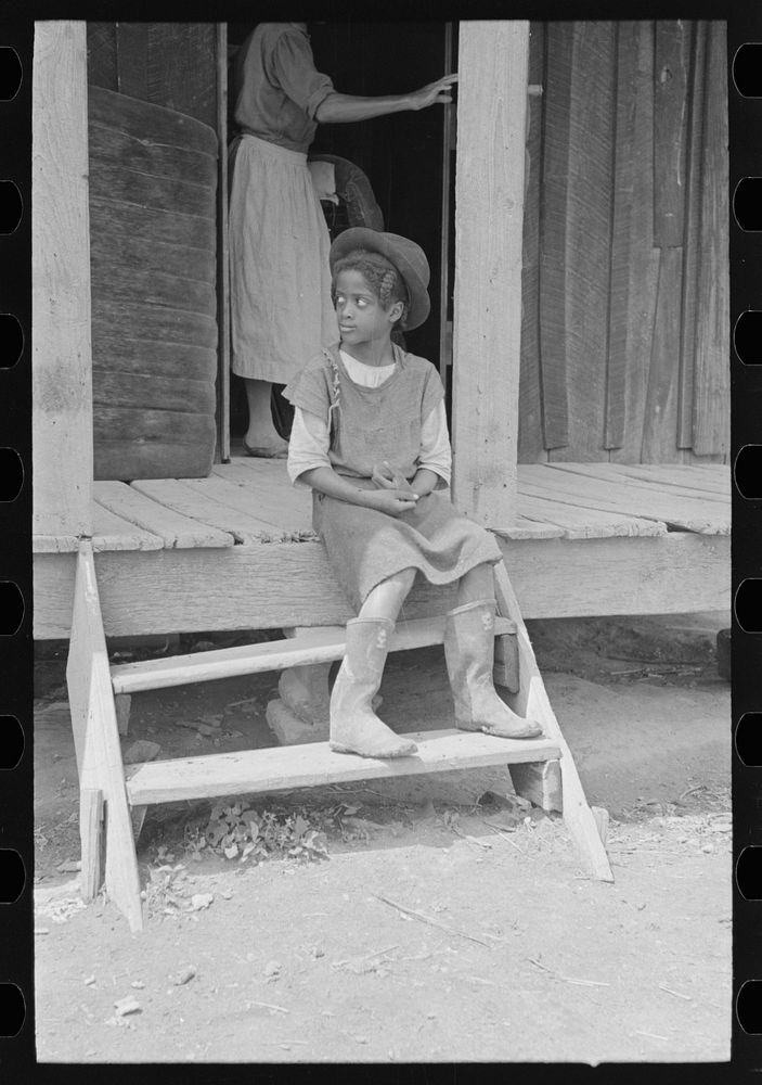 Daughter of sharecropper on steps of front porch, New Madrid County, Missouri by Russell Lee