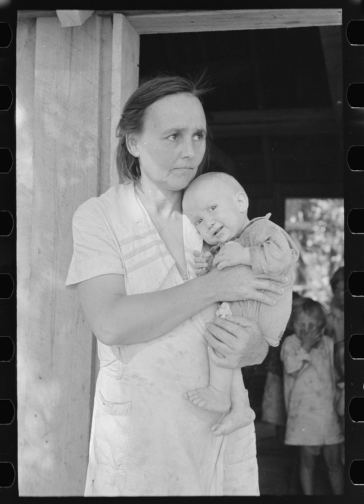 Wife and child of sharecropper, cut-over farmer in bottom lands of Mississippi River by Russell Lee
