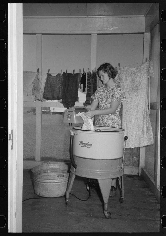 Farm wife washing clothes, Lake Dick Project, Arkansas by Russell Lee