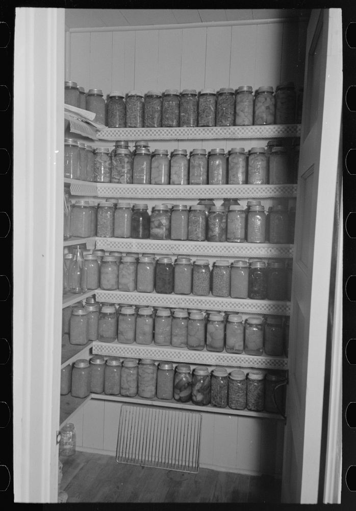 Canned goods in project home, Lake Dick, Arkansas by Russell Lee