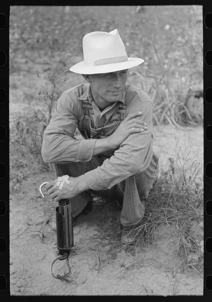 Member of cooperative association, with cotton scale, Lake Dick Project, Arkansas by Russell Lee