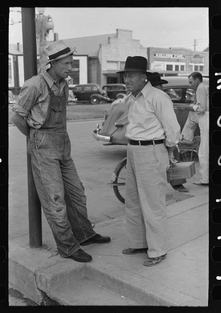Farmers talking on street corner, Crowley, Louisiana by Russell Lee