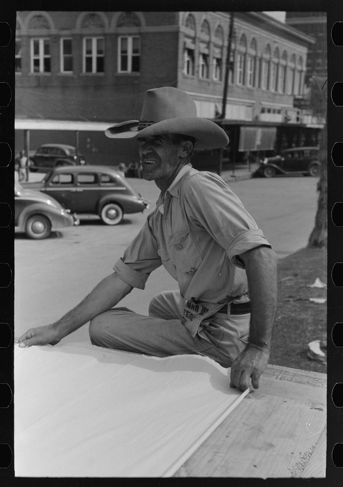 [Untitled photo, possibly related to: Window sign painter preparing to apply letters, Crowley, Louisiana] by Russell Lee