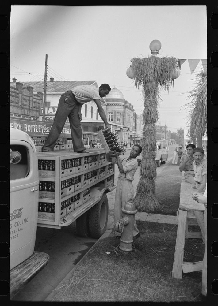 Unloading bottled drinks from truck, National Rice Festival, Crowley, Louisiana by Russell Lee