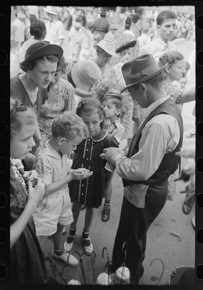 [Untitled photo, possibly related to: People standing on sidewalk watching parade, National Rice Festival, Crowley…