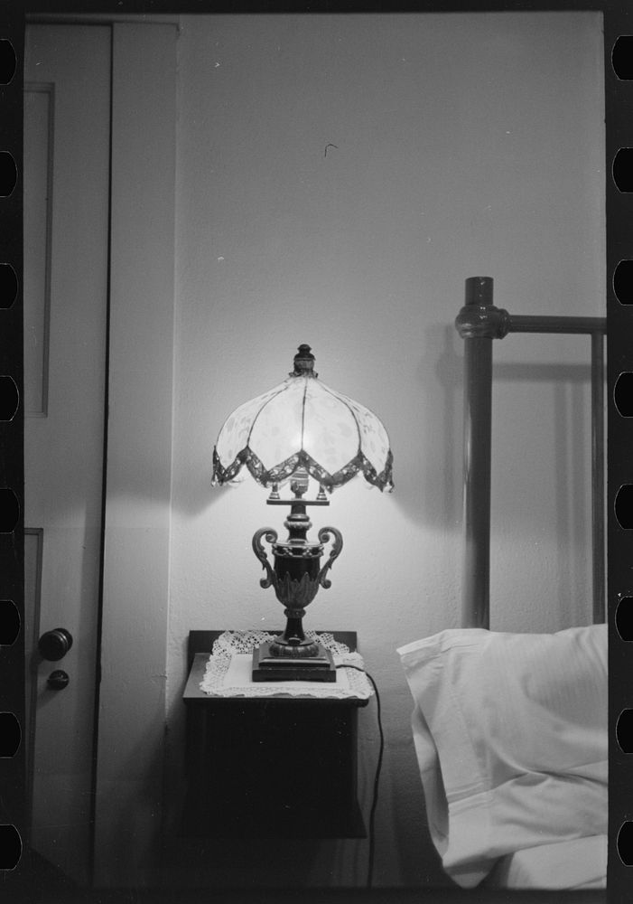 Bedroom with lamp in hotel at Donaldsonville, Louisiana by Russell Lee