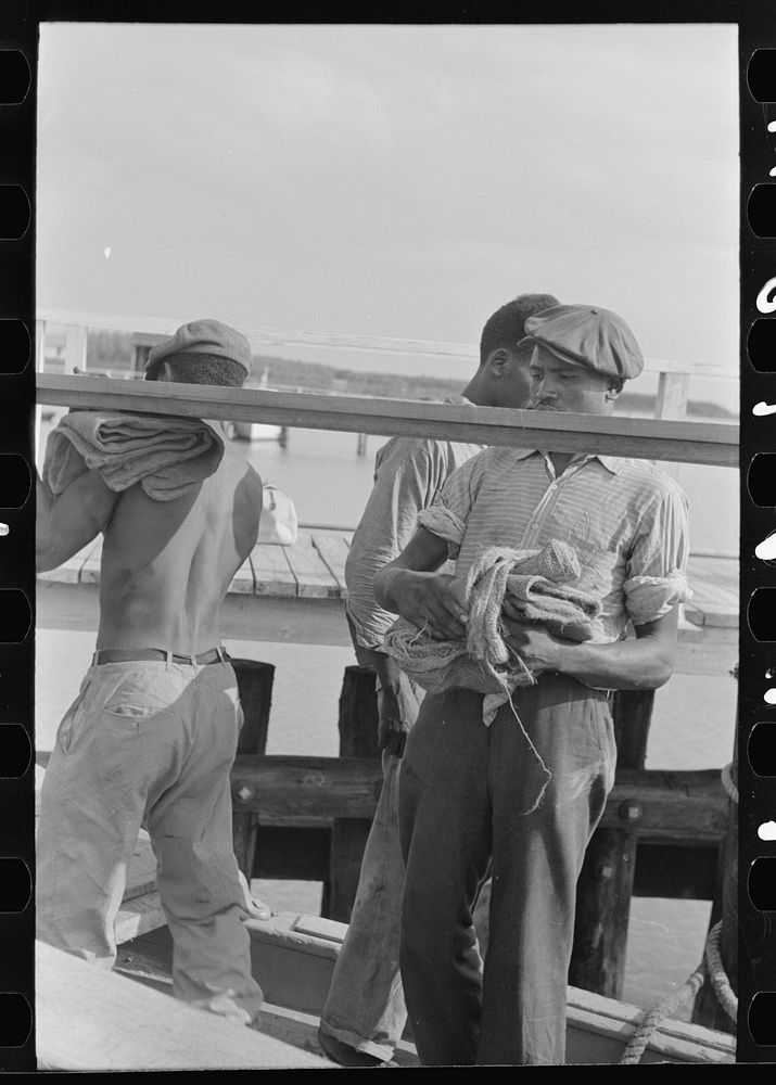 [Untitled photo, possibly related to:  stevedores handling lumber in unloading process, unloading the "El Rito," Pilottown…