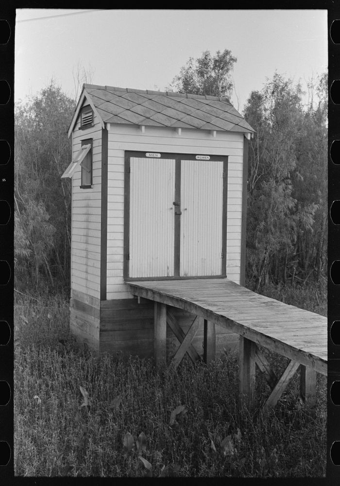 Privy adjacent to barroom, Pilottown, Louisiana by Russell Lee