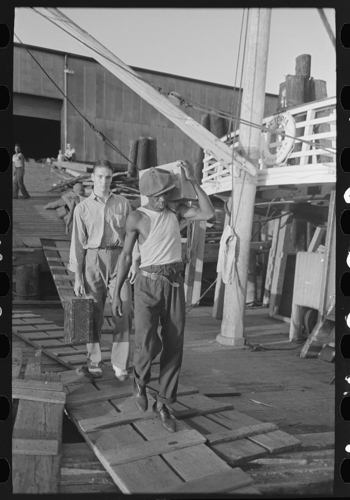 [Untitled photo, possibly related to:  stevedore, with lumber on shoulder, New Orleans, Louisiana] by Russell Lee