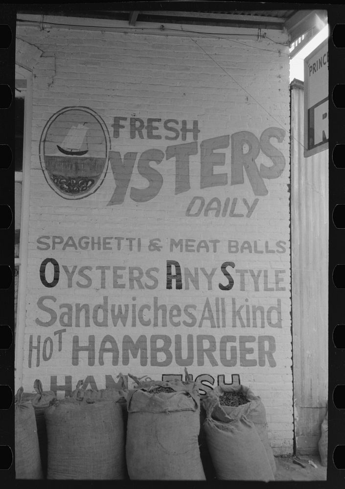 Sign in front of restaurant, Saint Martinville, Louisiana by Russell Lee