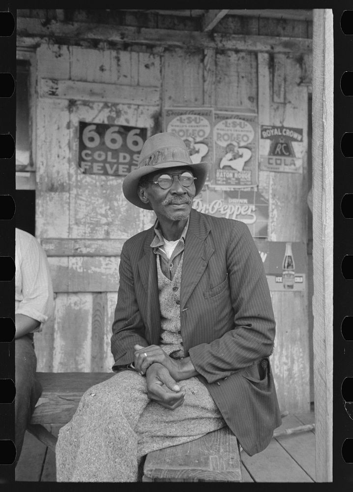  on porch of general store near Jeanerette, Louisiana by Russell Lee