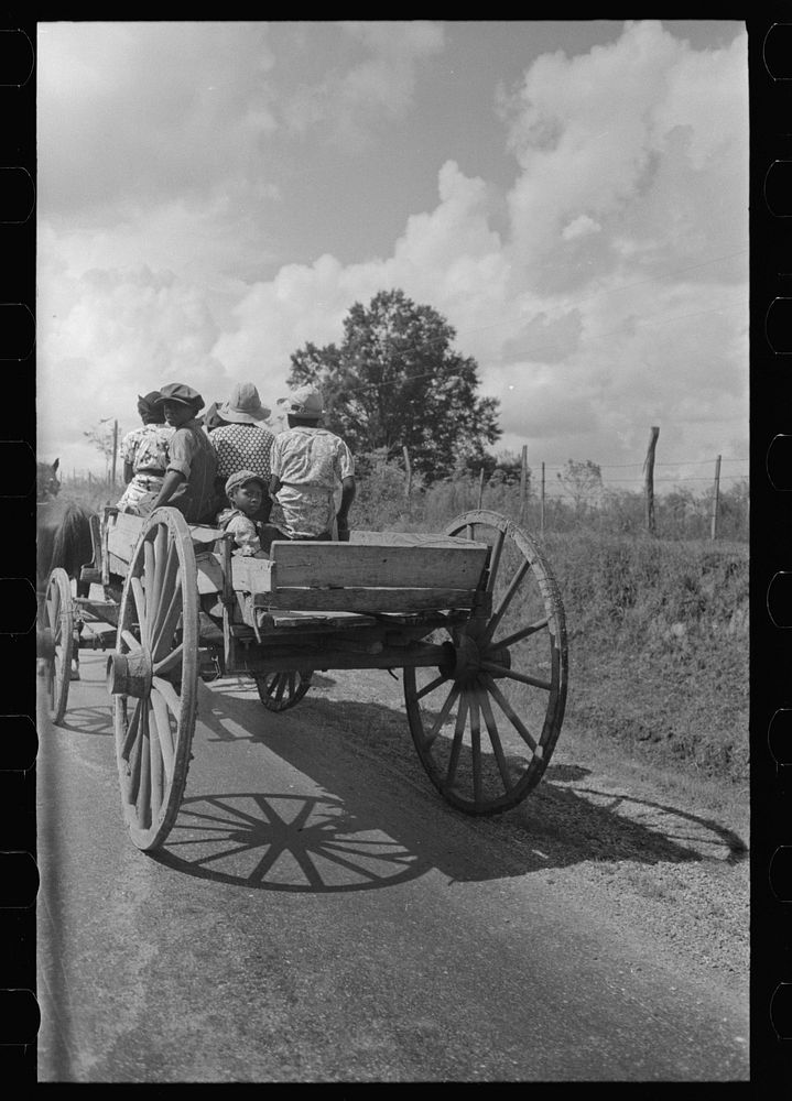 Family going to town in wagon near Opelousas, Louisiana by Russell Lee
