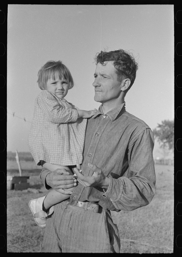 Cajun sugarcane farmer with daughter, near New Iberia, Louisiana by Russell Lee
