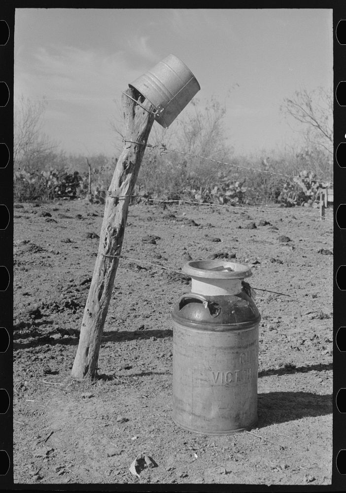Milk can and pail for pickup truck near Santa Maria, Texas by Russell Lee