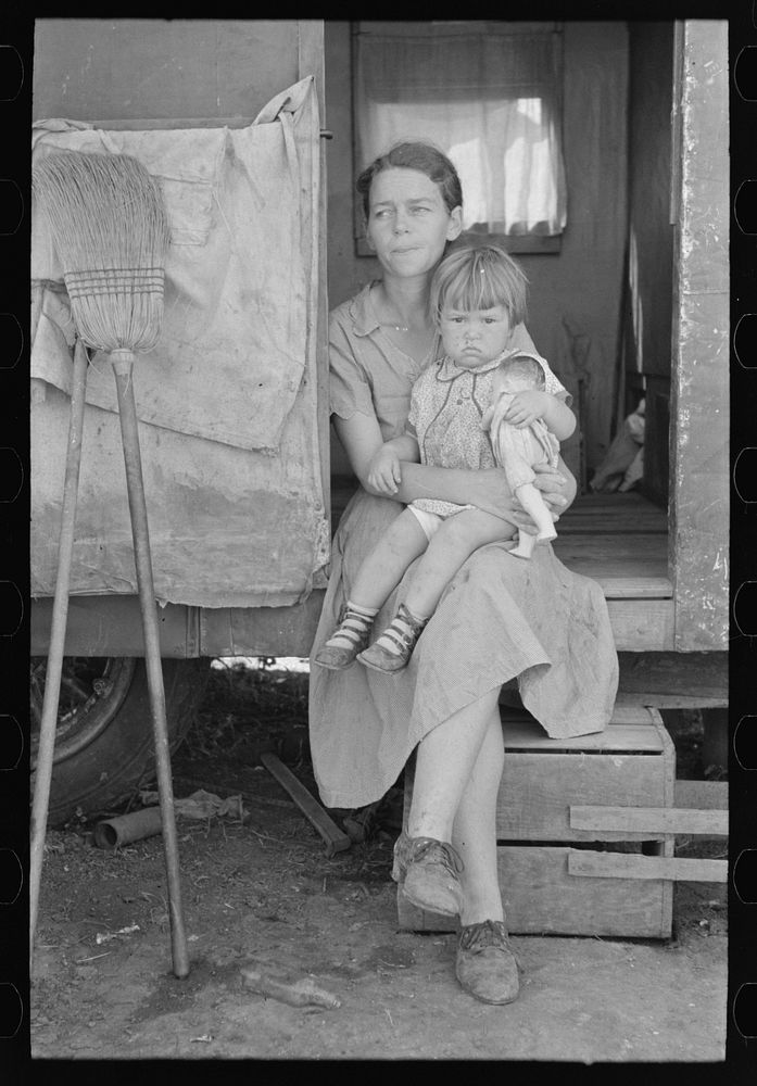 White migrant mother with daughter in door of trailer home near Weslaco, Texas by Russell Lee