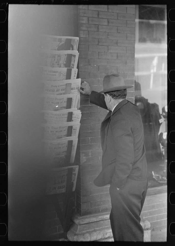 [Untitled photo, possibly related to: Merchant talking to prospective customer, Laurel, Mississippi] by Russell Lee