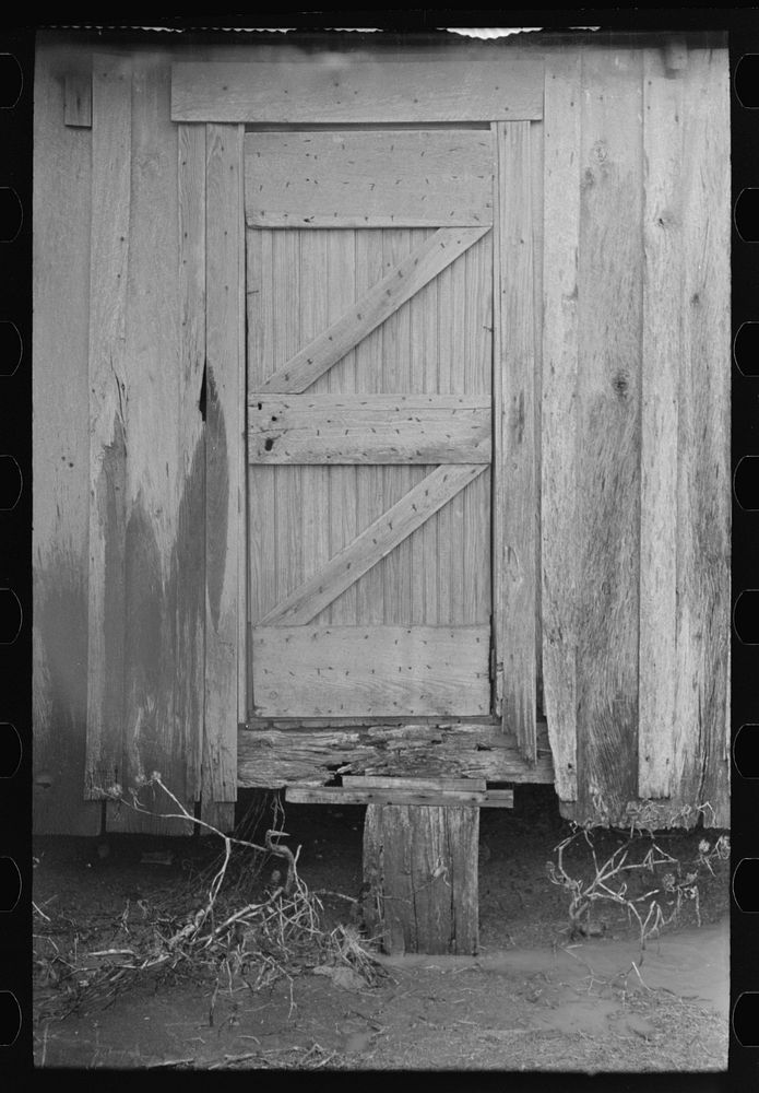 Back door of sharecropper's house, Pace, Mississippi. Background photo for Sunflower Plantation. by Russell Lee