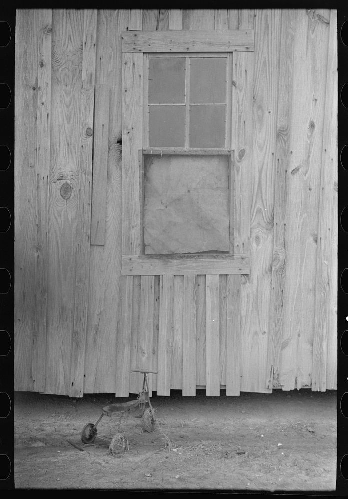 [Untitled photo, possibly related to: Side of sharecropper's cabin near Pace, Mississippi. Background photo for Sunflower…