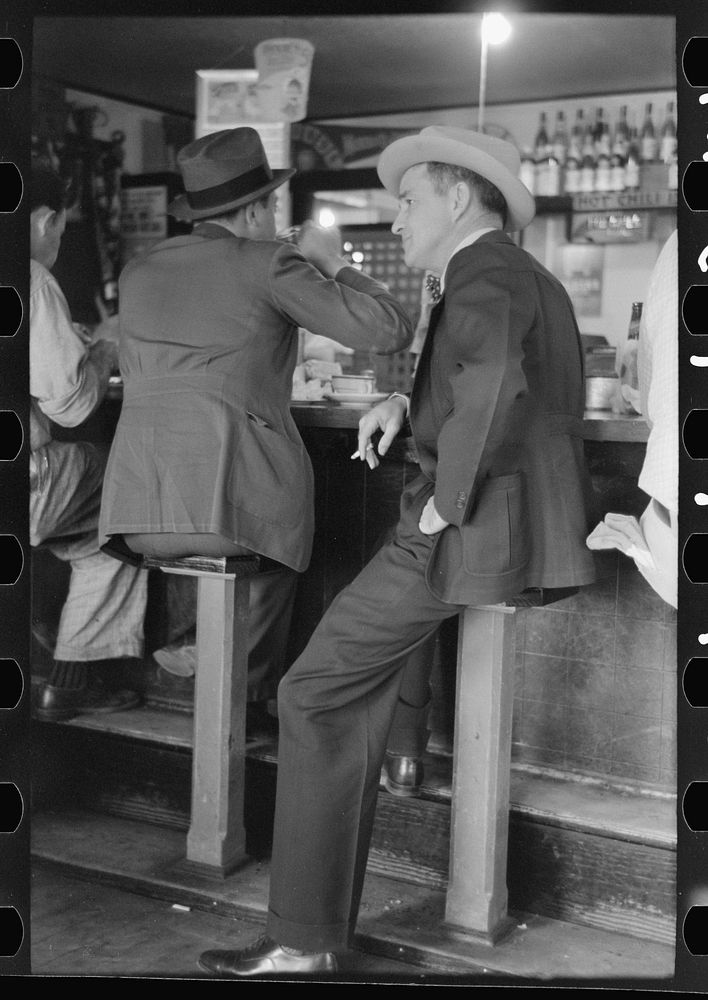 Men sitting at lunch counter, Raymondville, Texas by Russell Lee